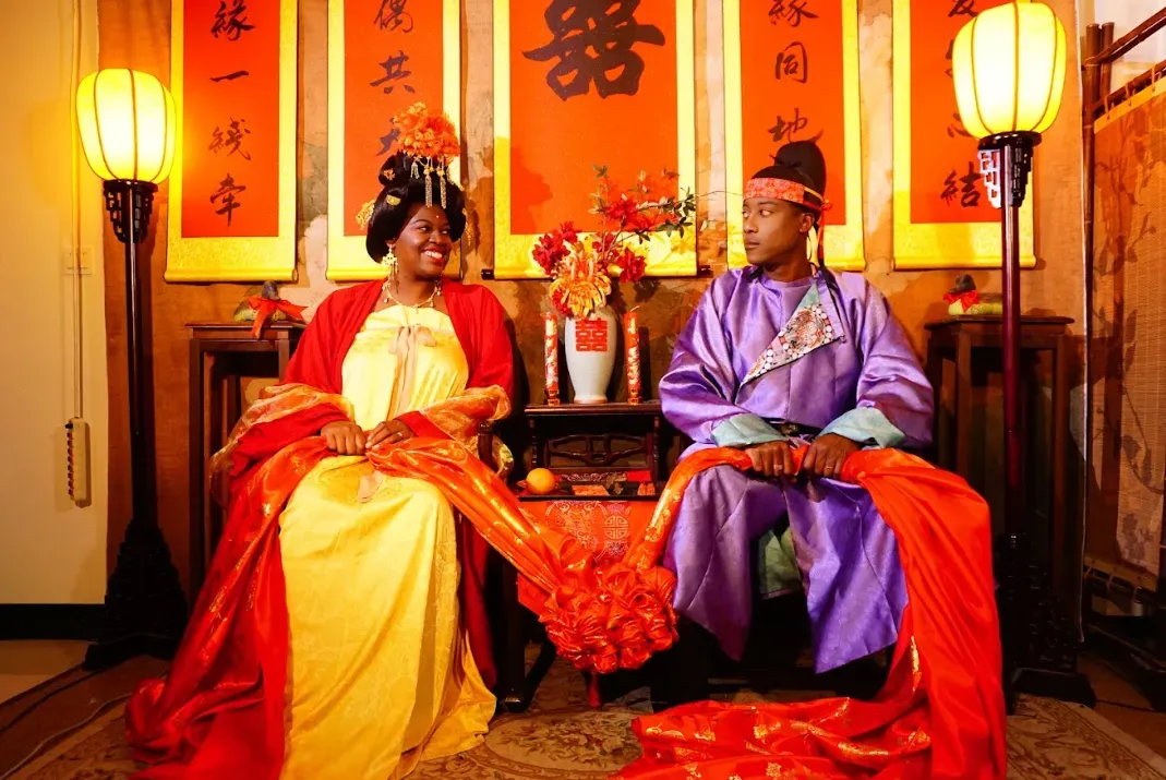 International students wearing Tang Dynasty hanfu during a cultural experience day in China, showcasing traditional hairstyles, hufu clothing, ancient accessories, and the open, diverse spirit of Tang Dynasty history.